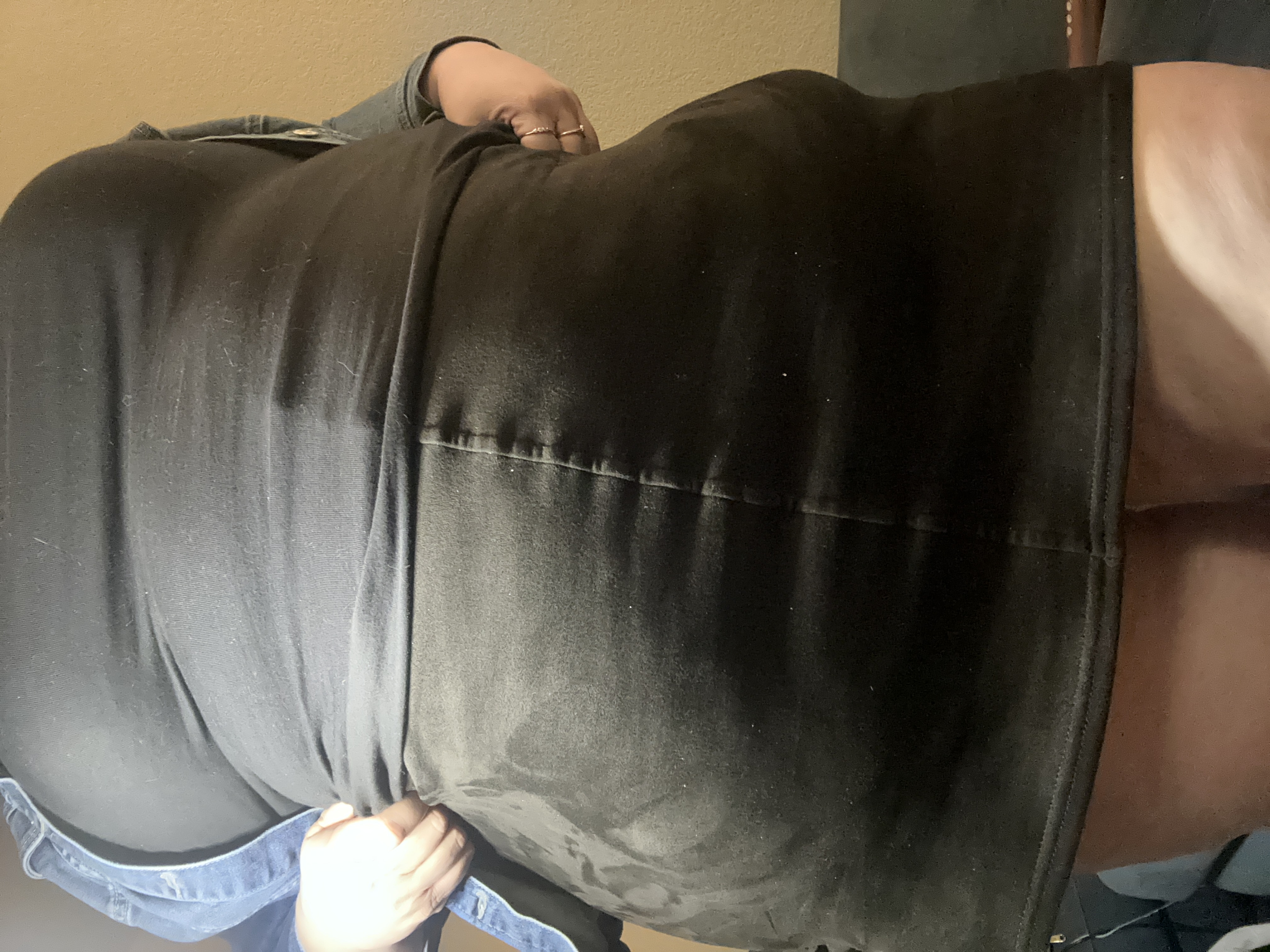 Anna's torso and upper thighs in a short skirt